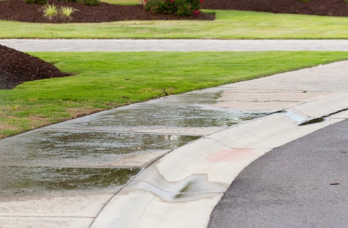 sidewalk with sprinklers