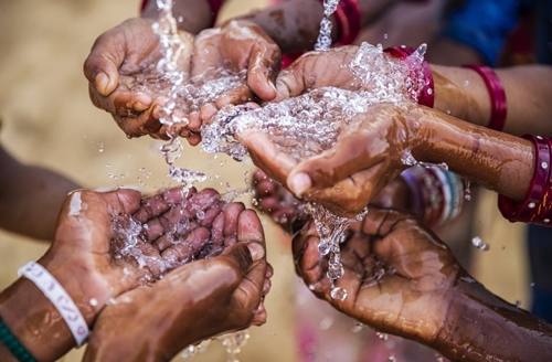 children keeping their hands up and asking for support