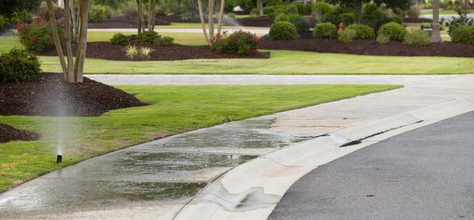 sprinkler on side walk
