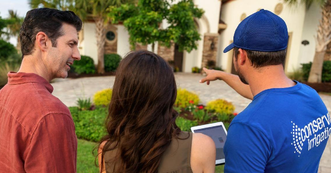 Conserva Irrigation technician helps customers with their irrigation system