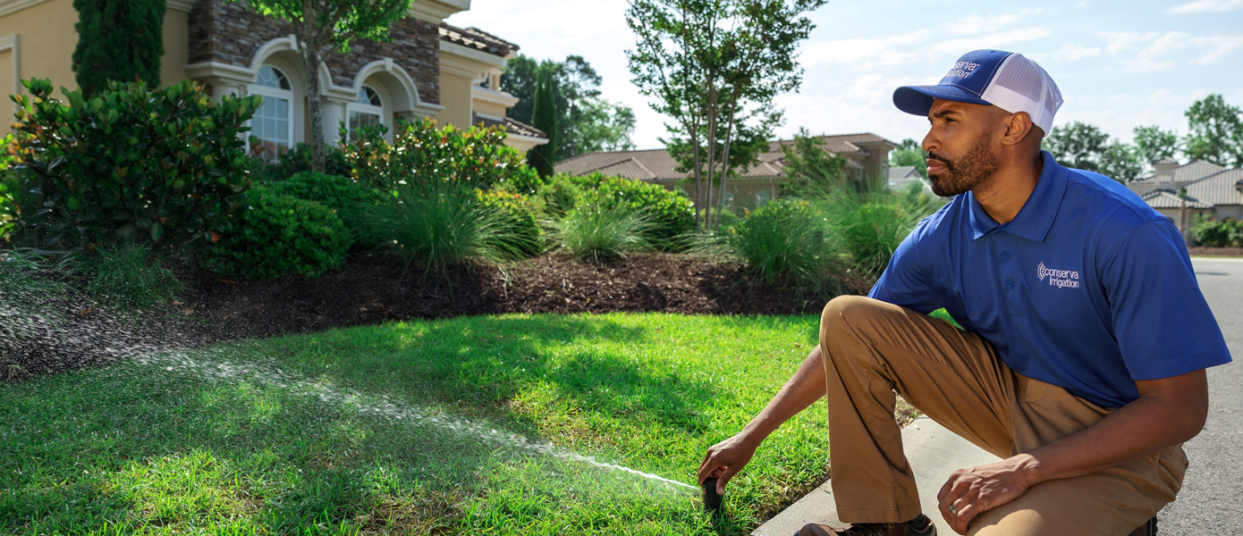 sprinkler head adjustment with technician 