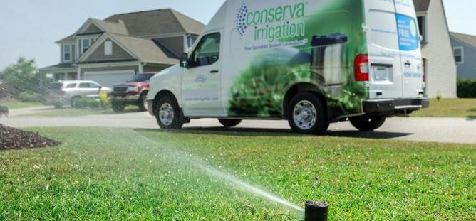 Photo of Conserva Truck with sprinkler in grass