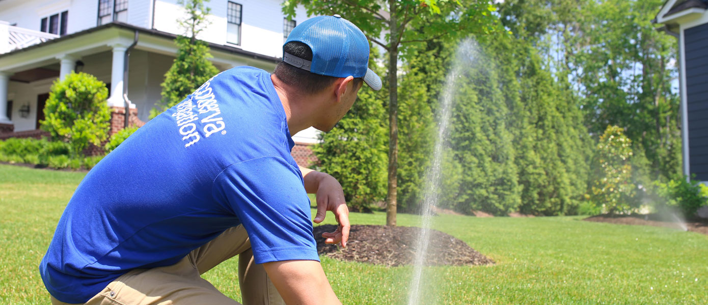 Conserva team member adjusting sprinkler in Northern Ohio
