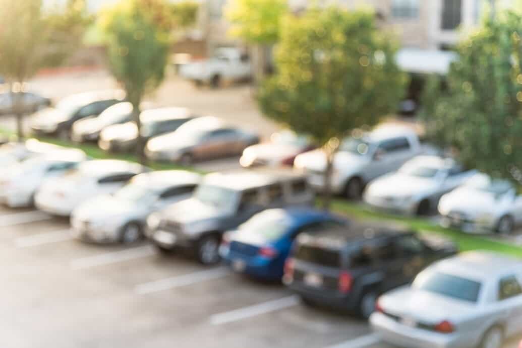 looking out of a window view of cars in a parking lot 