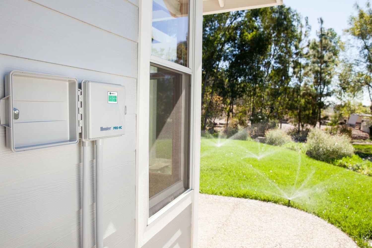 sprinkler system box on the side of a house